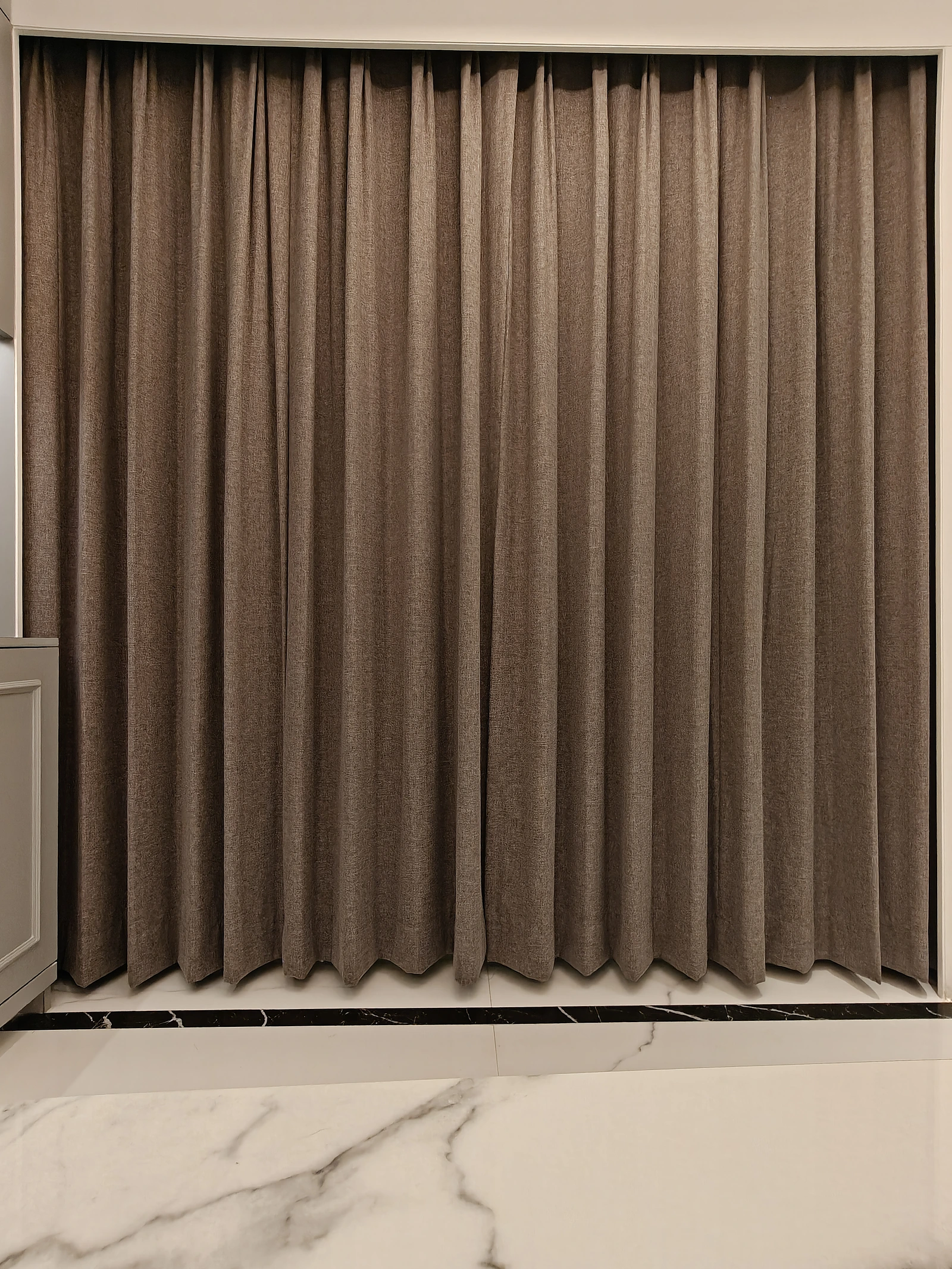 Blackout curtains drawn across a window
